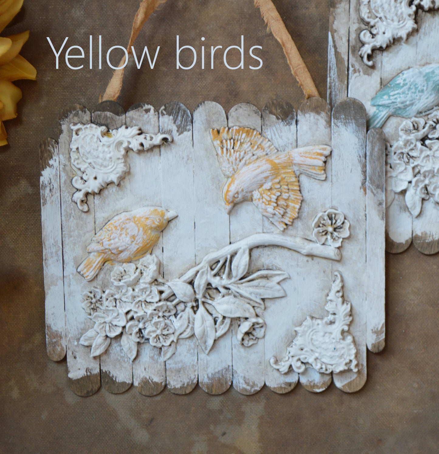 Ornate birds on a branch wall ornaments