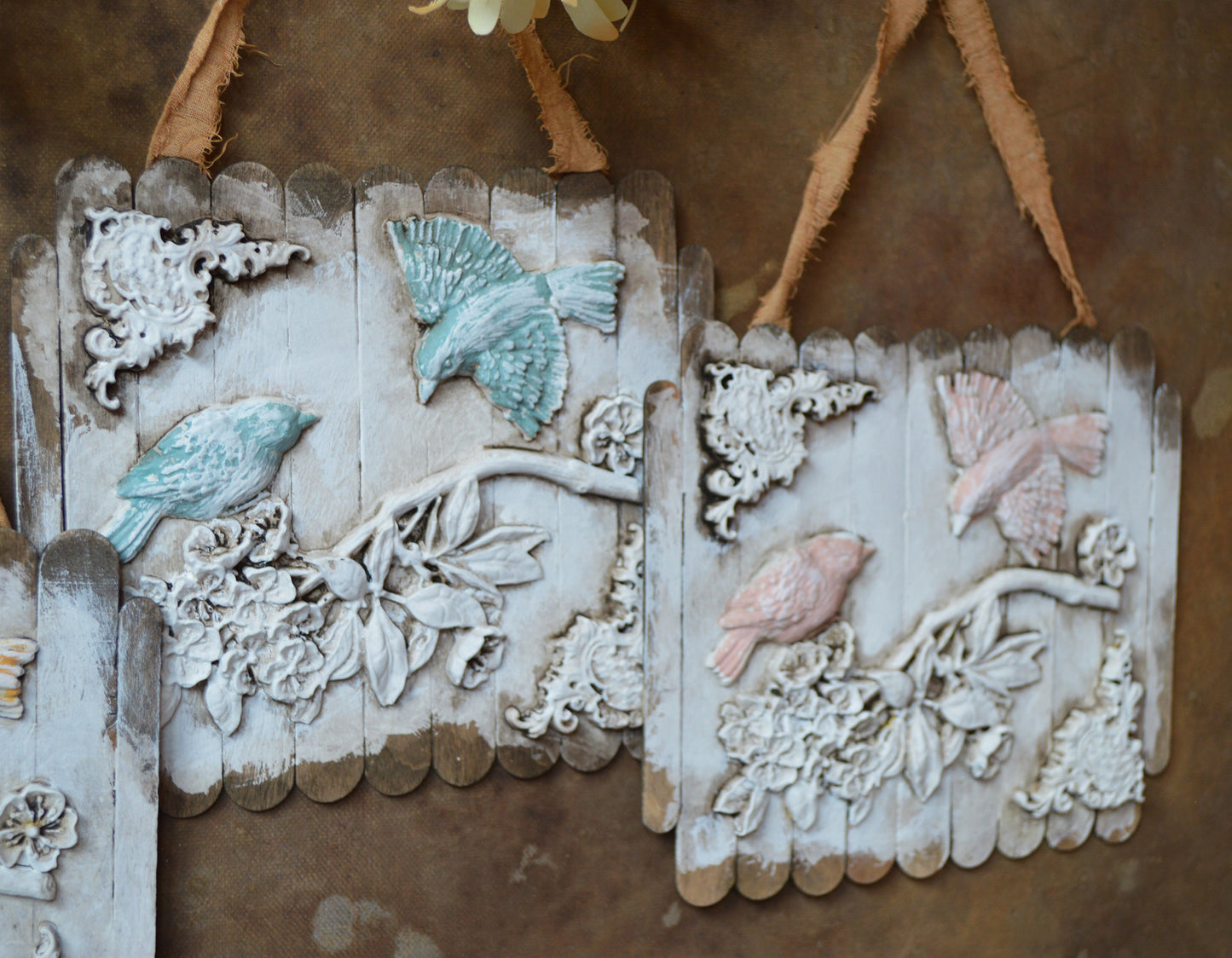 Ornate birds on a branch wall ornaments