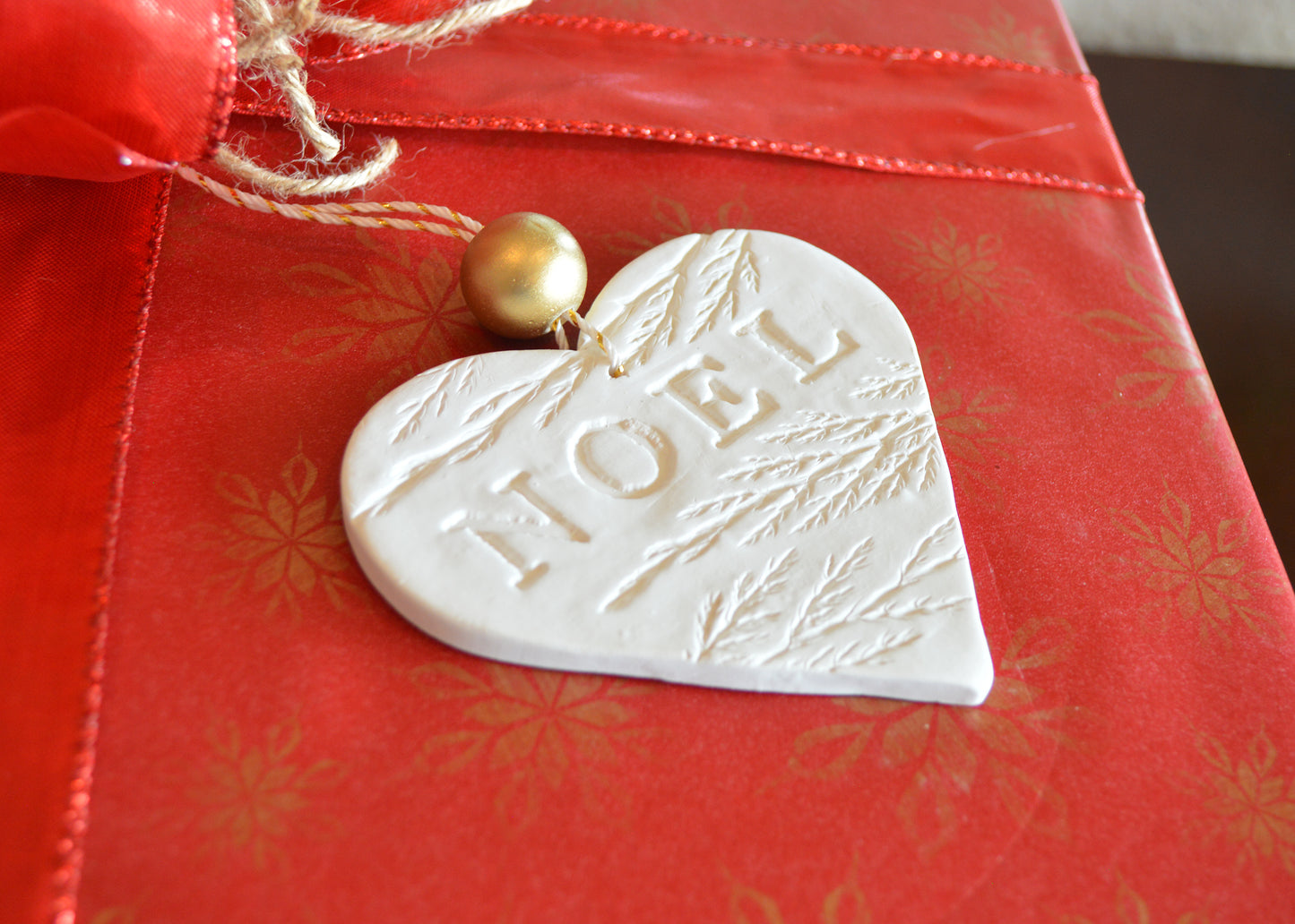 3 pure white heart shaped NOEL ornaments