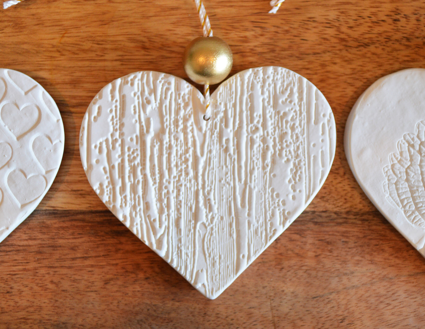 3 pure white heart shaped ornaments