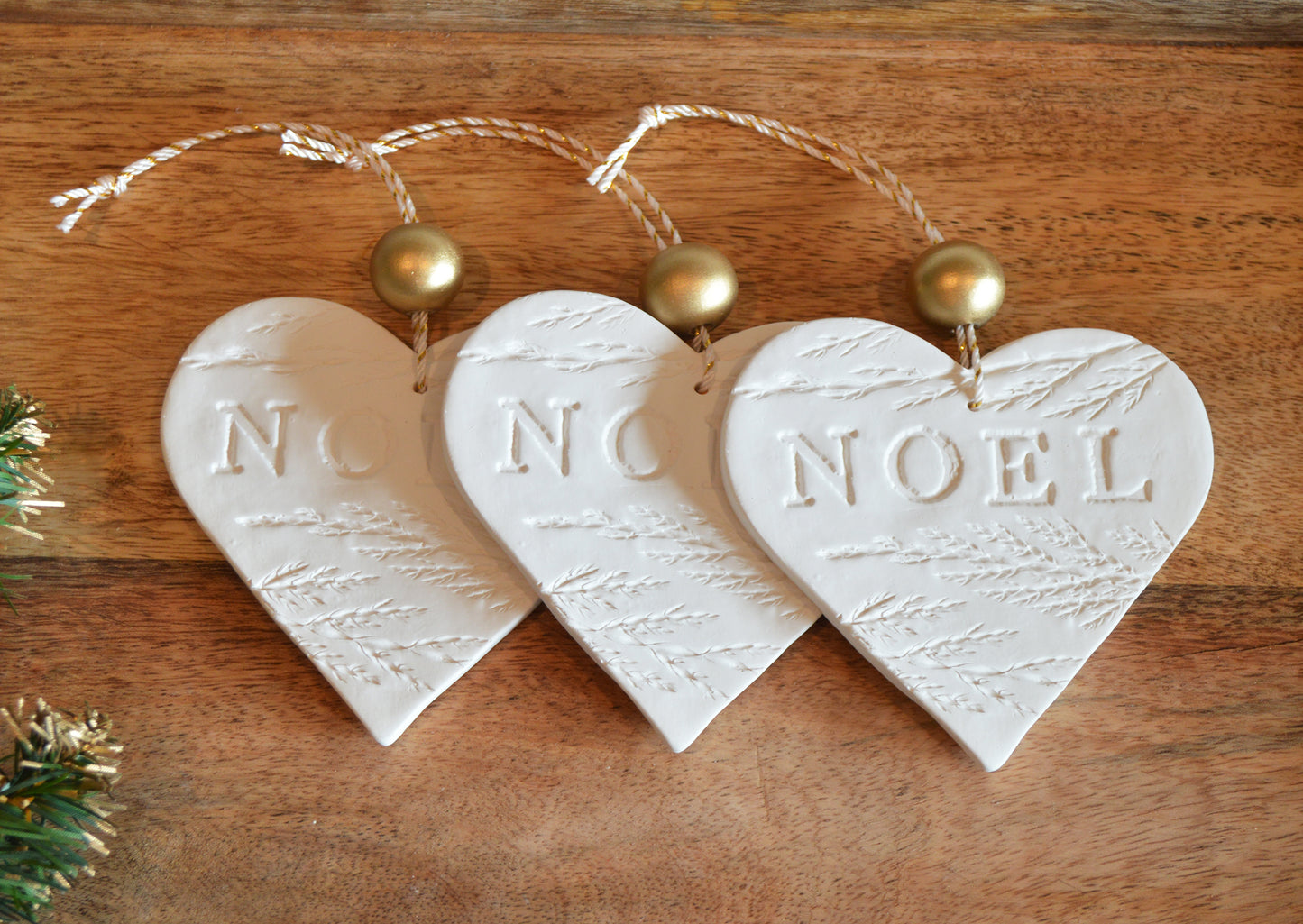 3 pure white heart shaped NOEL ornaments