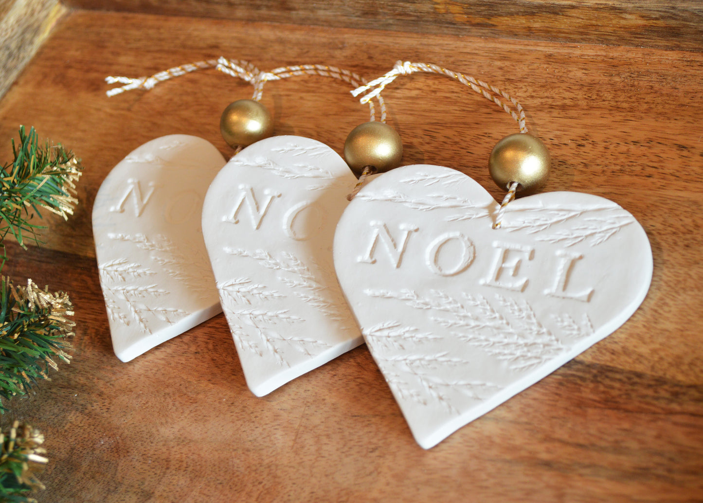 3 pure white heart shaped NOEL ornaments